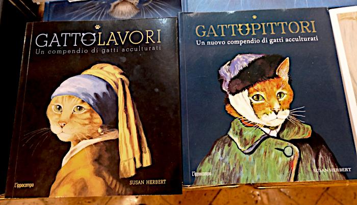 Foto van kunstboeken voor kinderen, een met een kat als ‘Het meisje met de parel’ (Johannes Vermeer) en een ander met een kat als Van Gogh op het ‘Zelfportret met verbonden oor’